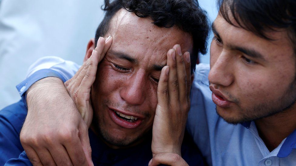 Man cries outside hospital in Kabul. 23 July 2016