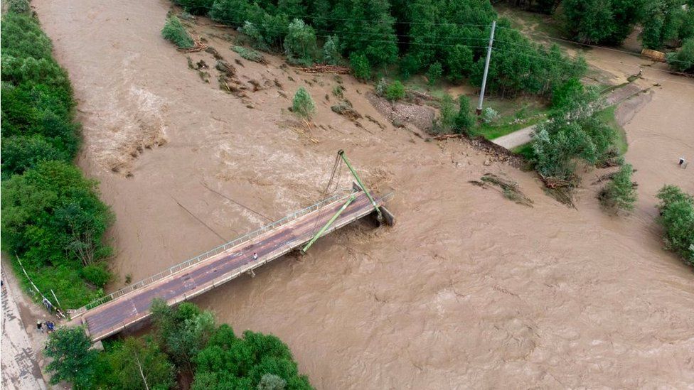 A flooded river destroys a bridge in Ukraine, June 2020
