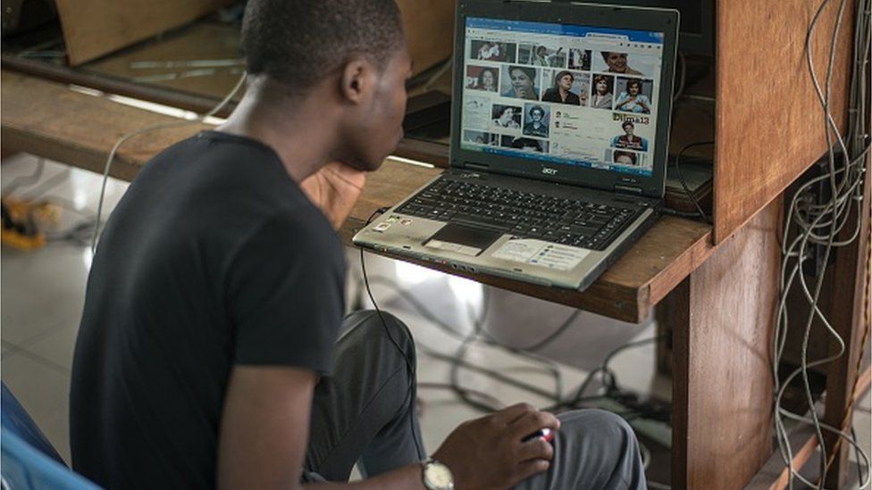 Clients surf the internet at an internet cafe on February 25, 2015 in Kinshasa, DR Congo.