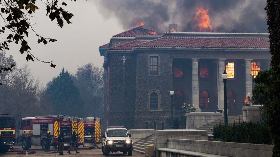 Firefighters try to extinguish a fire in the Jagger Library, at the University of Cape Town