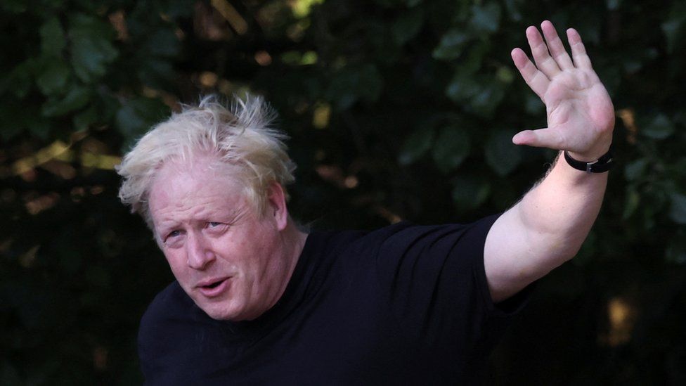 Boris Johnson waving during a jog
