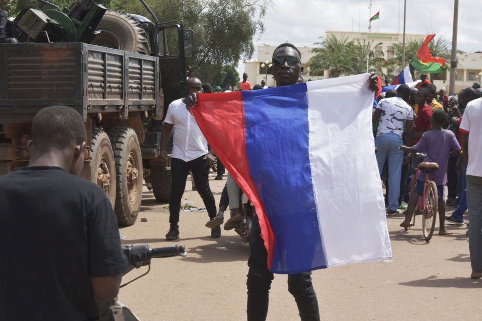Some waved Russian flags on Sunday in Ouagadougou.