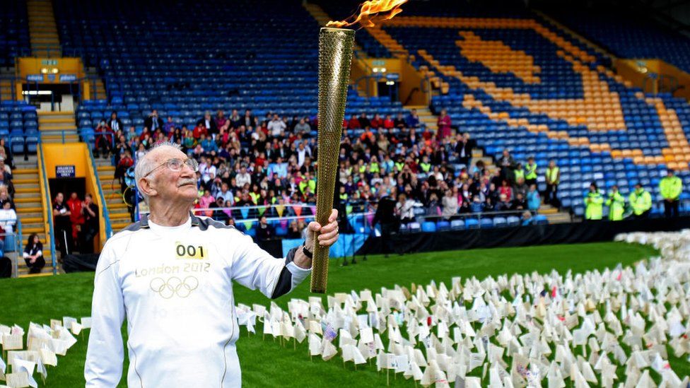 John Jenkins with Olympic flame