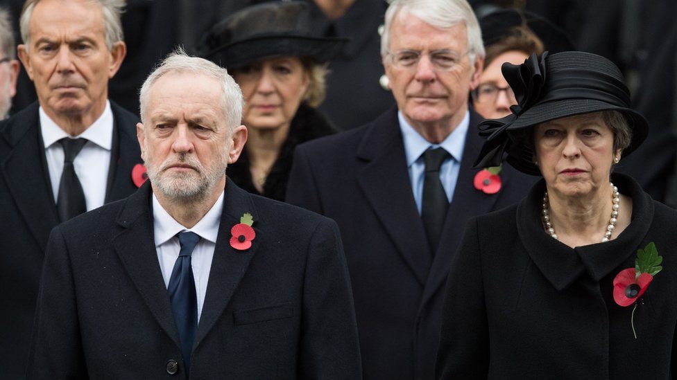 Prime Minister Theresa May, Opposition Leader Jeremy Corbyn and former prime ministers Tony Blair and John Major wear the red poppy on Remembrance Sunday last year