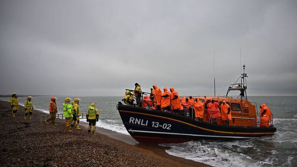 Migrants helped ashore to the UK by the RNLI