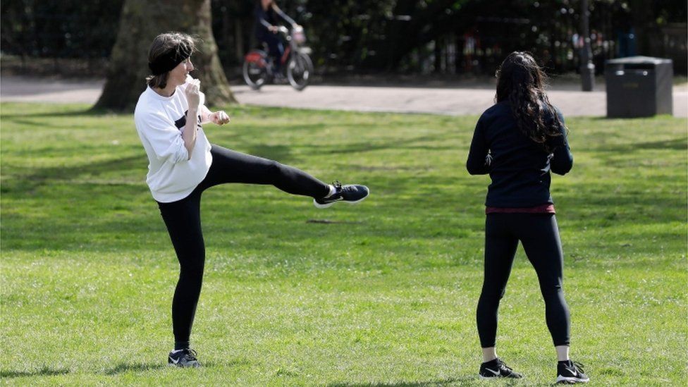 Women working out in a field