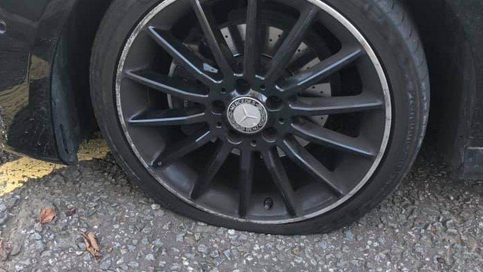 Flat tyre on a car at Parc Derwen