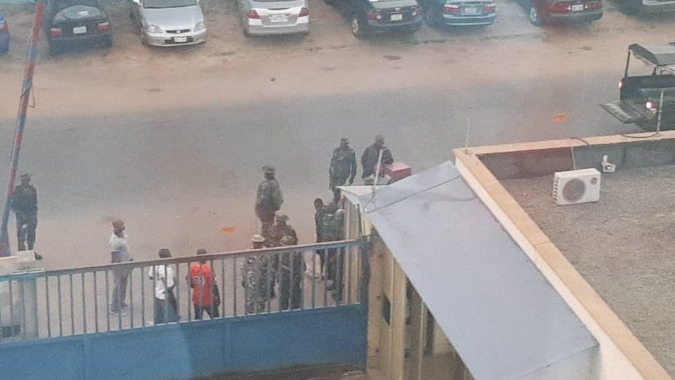 Soldiers by the gate of the Daily Trust newspaper in Abuja, Nigeria