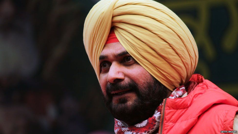 Former Indian cricketer and Congress party's Member of Legislative Assembly (MLA) Navjot Singh Sidhu addresses a gathering during a protest against the recent passing of Central government's agriculture reform bills in the parliament, in New Delhi on November 4, 2020