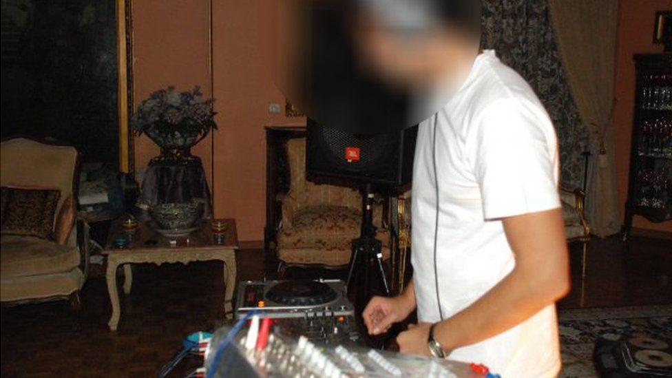 A DJ plays music at a party in Iran