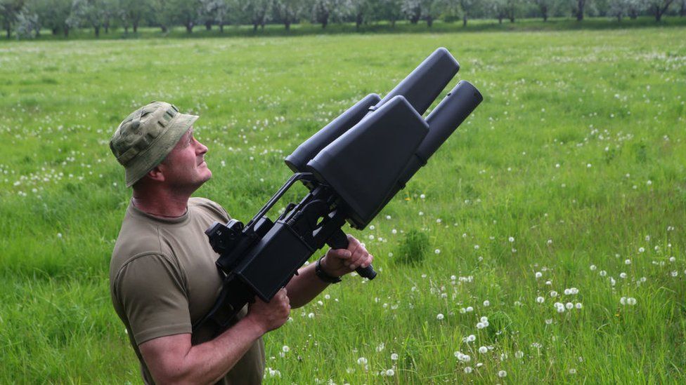 ukraine soldier with anti-drone rifle