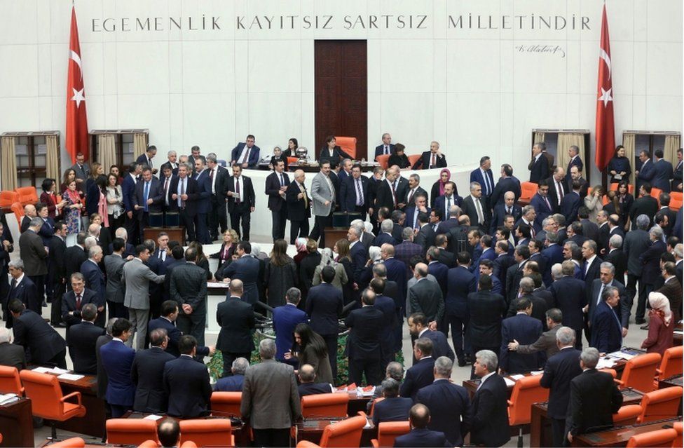 Lawmakers cast their votes during the second round of a debate in the proposed changes to the Turkish constitution, at the Turkish parliament in Ankara on January 21, 2017.