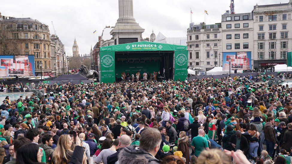 People talking part in the St Patrick's Day celebrations in Trafalgar Square, central London.