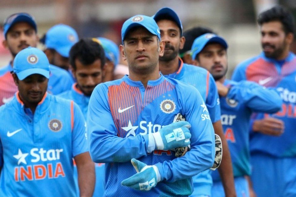 This file photo taken on June 22, 2016 shows India captain Mahendra Singh Dhoni leading his team after victory during the third and final T20 cricket match in a series of three games between India and Zimbabwe in the Prayag Cup at Harare Sports Club.