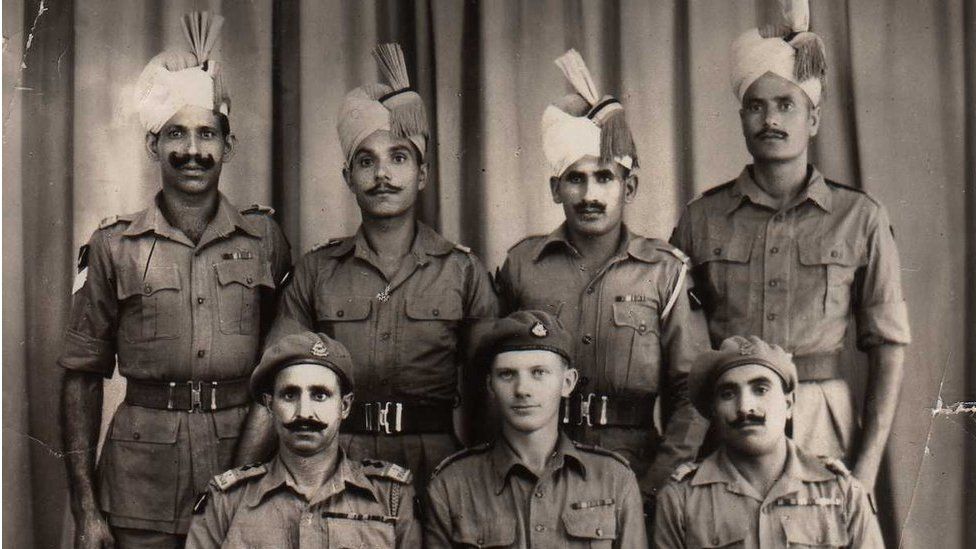 Robin Rowland (seated, centre) with members of the Punjab regiment, pictured in Bangkok in 1945