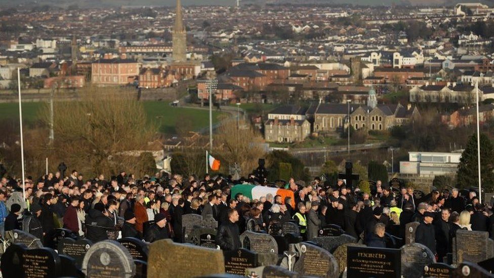 The coffin of the late Martin McGuinness is carried into the Derry City Cemetery on 23 March 2017
