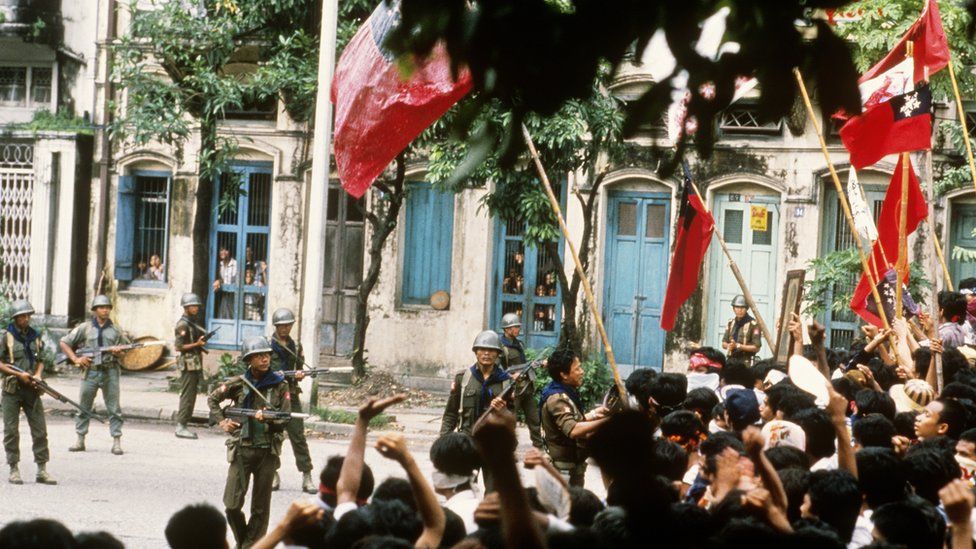 Protesters and military in a Yangon street in 1988