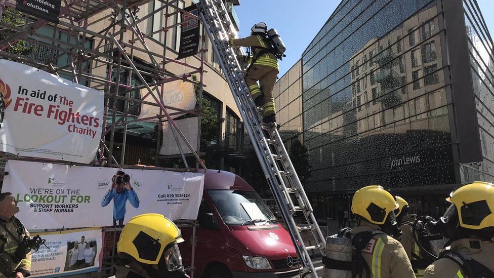South Wales Fire and Rescue Service firefighters take part in the ladder climb