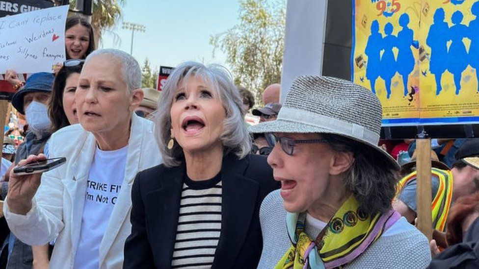 Actors Lily Tomlin and Jane Fonda support striking writers
