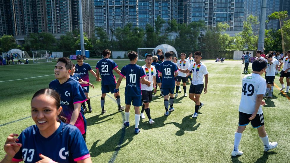 Competitors interact after a football match at the Gay Games in Hong Kong this week