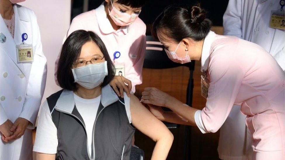 A nurse administers a dose of Medigen Vaccine Biologics Corp"s Covid-19 vaccine to Preisdent Tsai Ing-wen
