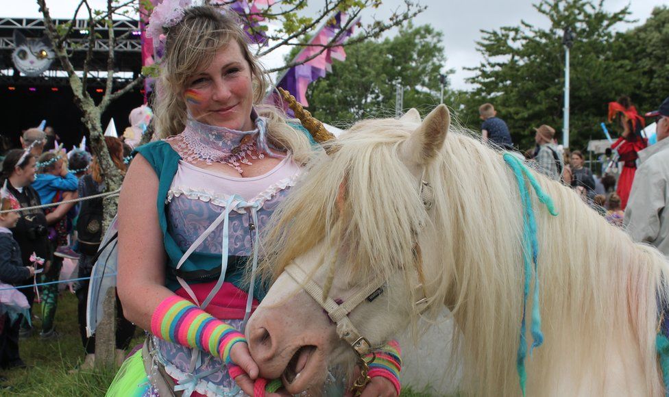 Sarah Sutton with her horse Moon dressed as a unicorn