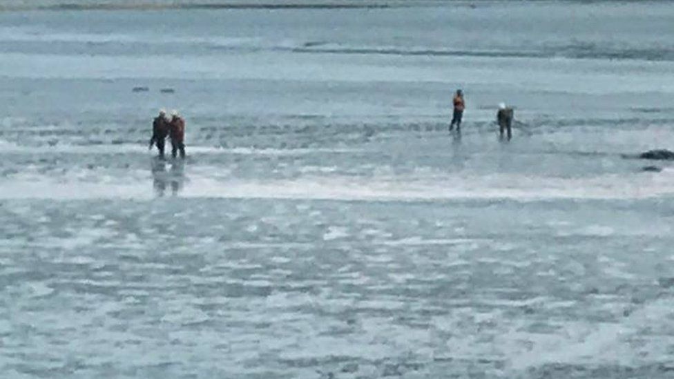 Boy rescued from waist deep mud on the Solway coast - BBC News