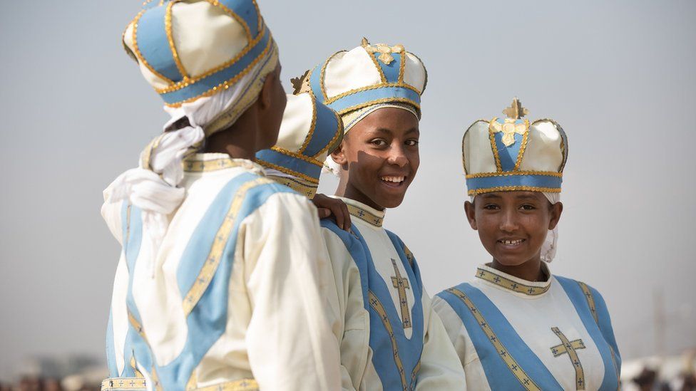 Young clergy girls react during the Timket, or Epiphany festival, in Addis Ababa, on January 19, 2018.