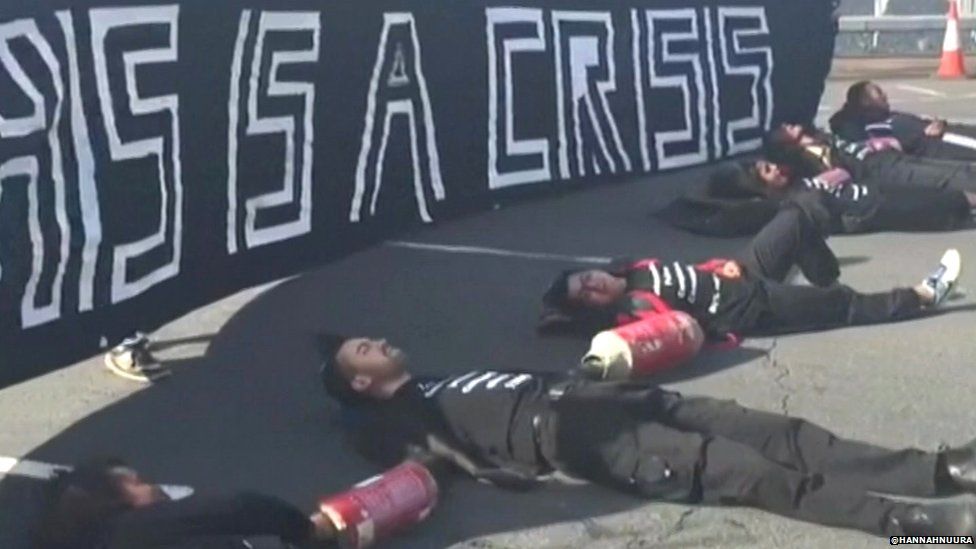 Black Lives Matter campaigners lying on the road