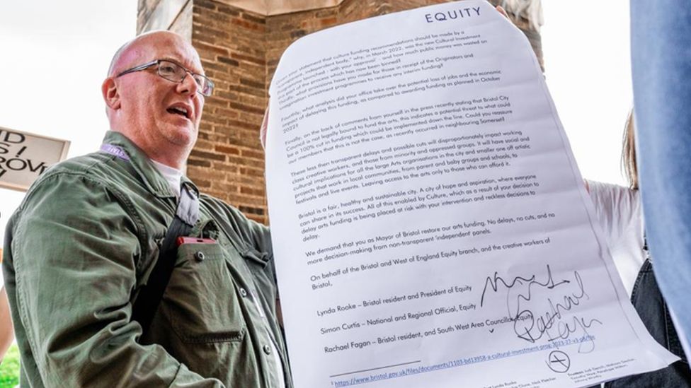 An Equity spokesperson with a petition