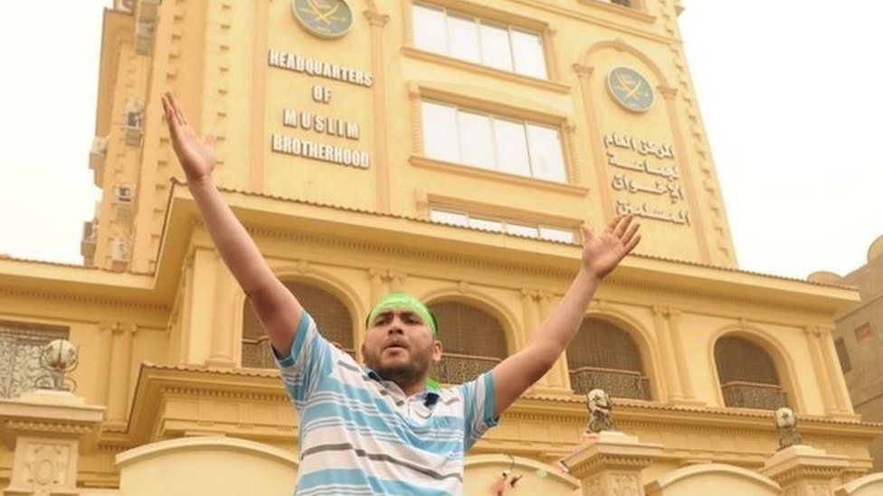 Muslim Brotherhood supporters outside the group's headquarters in Cairo in 2013