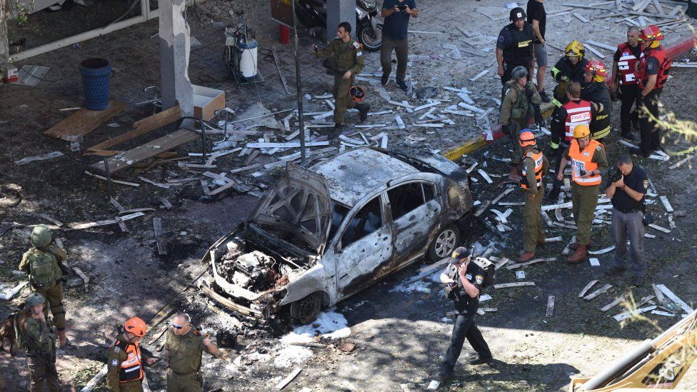 Police and rescue teams at the scene of a direct rocket hit in Ramat Gan, Israel, May 15, 2021