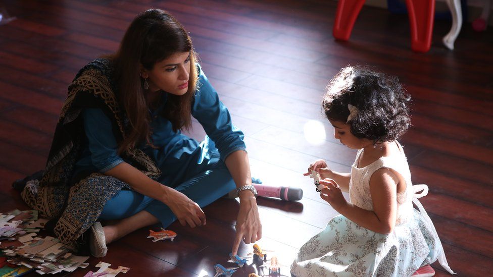 Dr Sara Saeed playing with her daughter