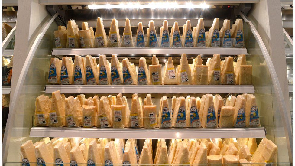 This picture shows Parmesan cheese displayed in the Eataly food emporium on June 12, 2012 in Rome.