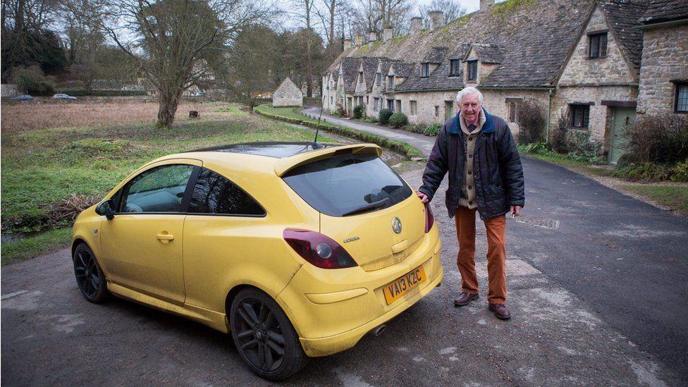 Peter Maddox and his yellow Vauxhall Corsa
