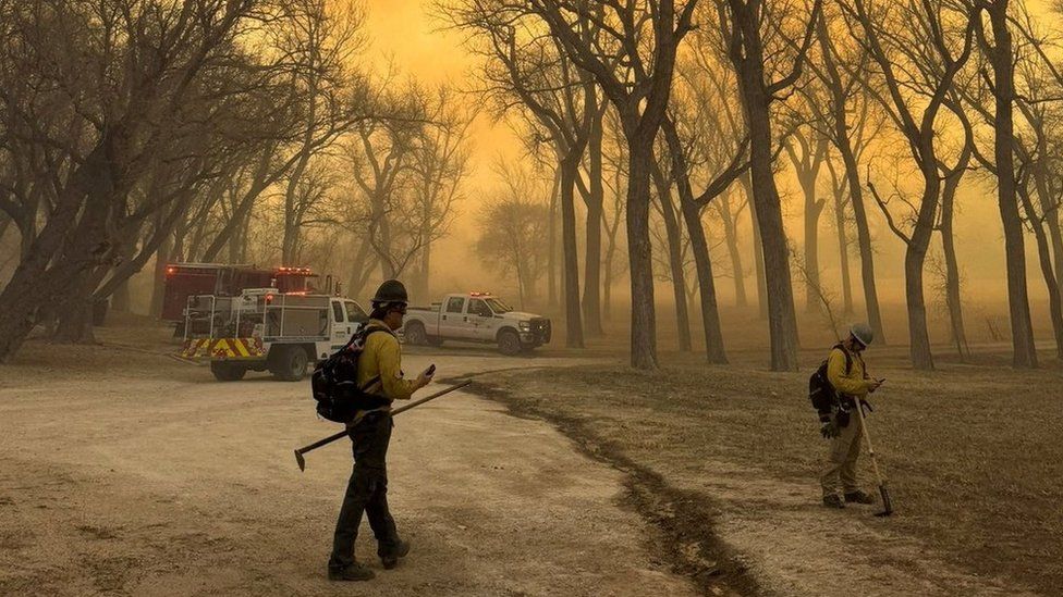 Firefighters operate outside the Smokehouse Creek Fire