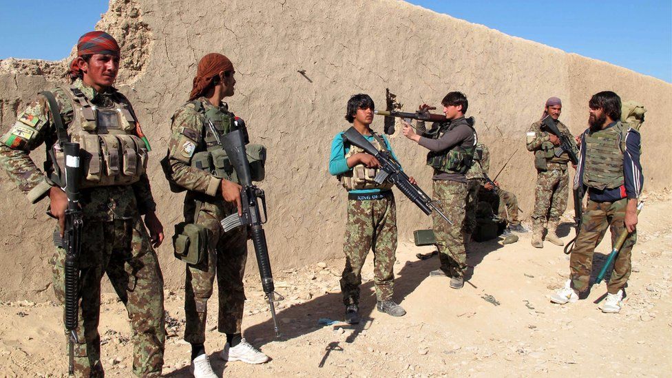 Afghan security forces patrol in Helmand province, 20 December 2015