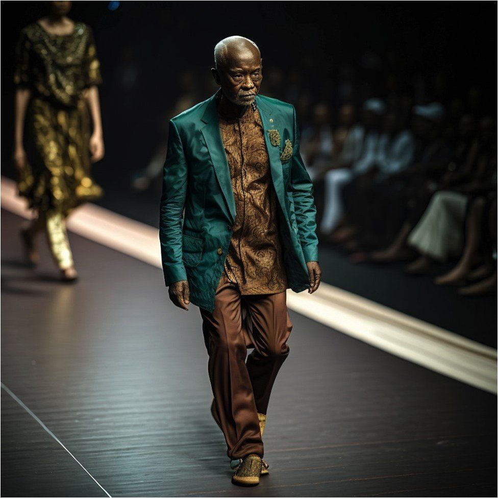 Man on runway in emerald blazer