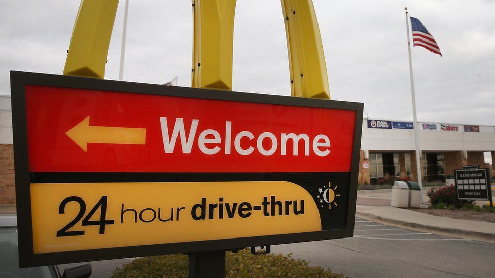 A sign directs customers to the drive-thru at a McDonald's restaurant on October 24, 2013 in Des Plaines, Illinois.