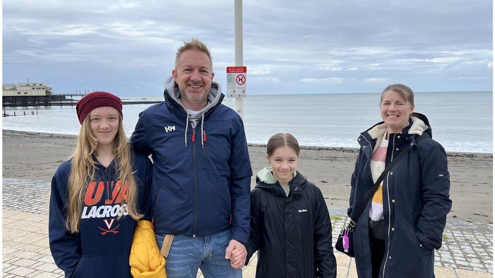 Simon Hancock and his family on the seafront