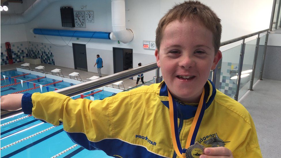James with a swimming medal