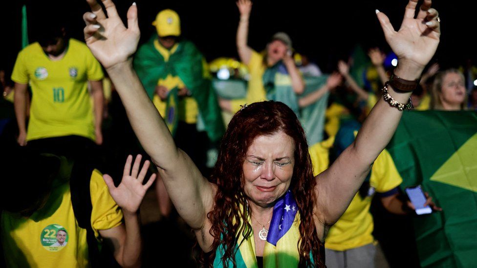 Jair Bolsonaro supporter cries during the Brazilian presidential election run-off in Brasilia