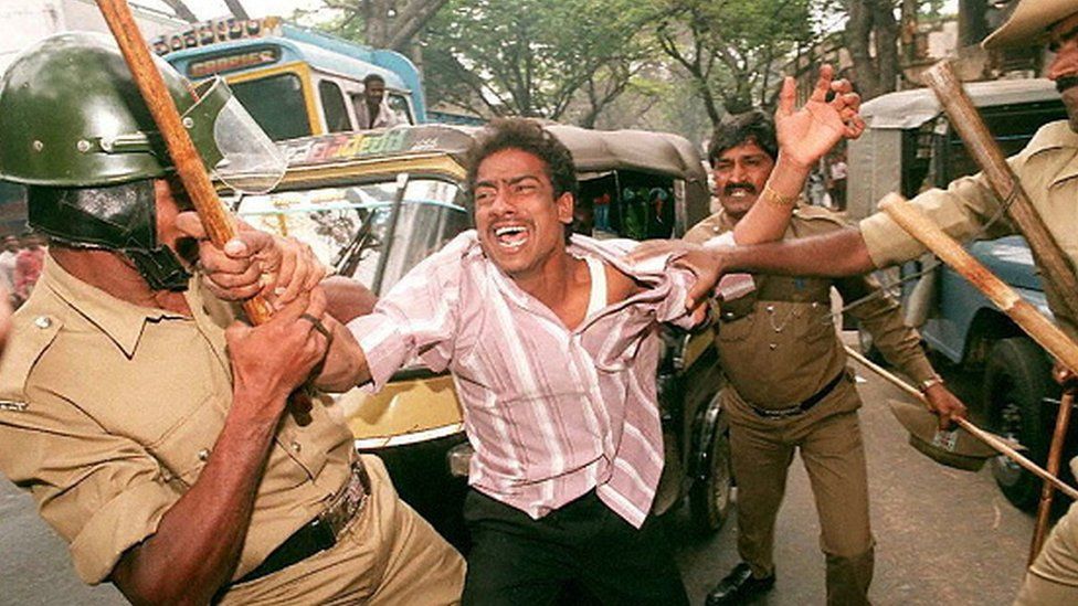 indian police stop demonstrators from a leftist women's group during a 23 November protest against the Miss World beauty pageant in Bangalore. The group attempted to disrupt traffic while marching toward Chinnaswamy Stadium, the venue for the pageant final later 23 November.