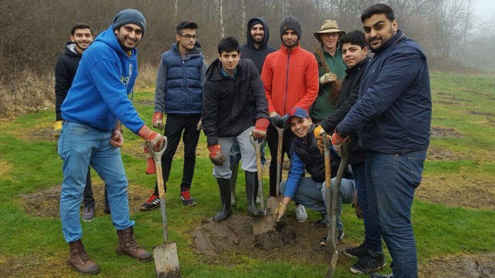 Members of The Ahmadiyya Muslim Youth Association planting trees