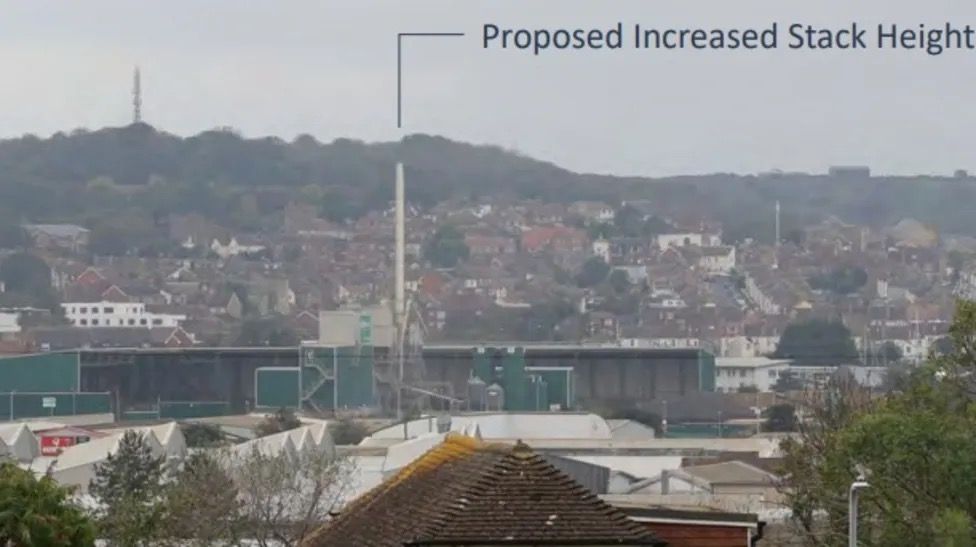 The asphalt plant chimney with a graphic showing the height it will be extended too.