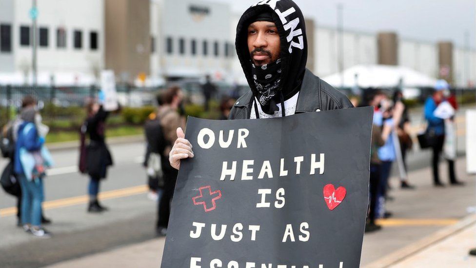 Former Amazon employee, Christian Smalls, stands with fellow demonstrators during a protest outside of an Amazon warehouse as the outbreak of the coronavirus disease (COVID-19) continues in the Staten Island borough of New York U.S., May 1, 2020.