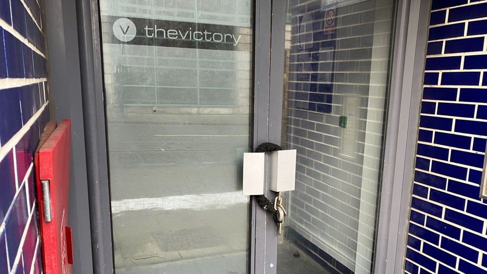 Locked door at Victory Apartments on Union Street in Oldham