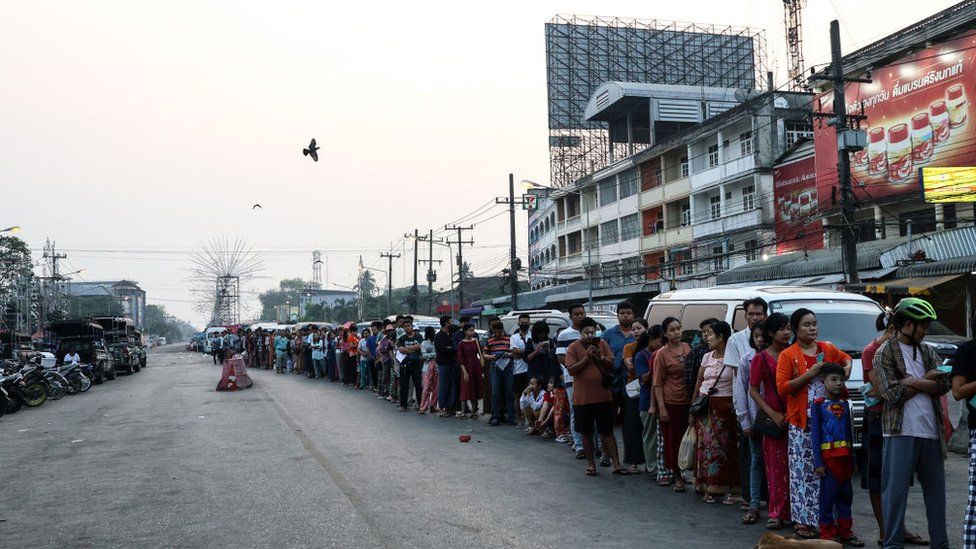 Myanmar people queue to cross the Thailand-Myanmar Friendship Bridge to renew their 7-day pass in Mae Sot, Thailand on April 11, 2024. Myanmar ethnic rebels and civilian militia took over from the military forces the town of Myawaddy, a crucial trade hub near the Thai border.