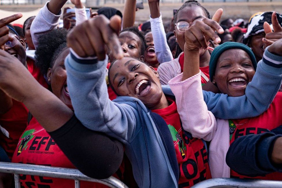 Supporters of the Economic Freedom Fighters (EFF) political party, sing and dance at the Makwarela stadium in Limpopo.