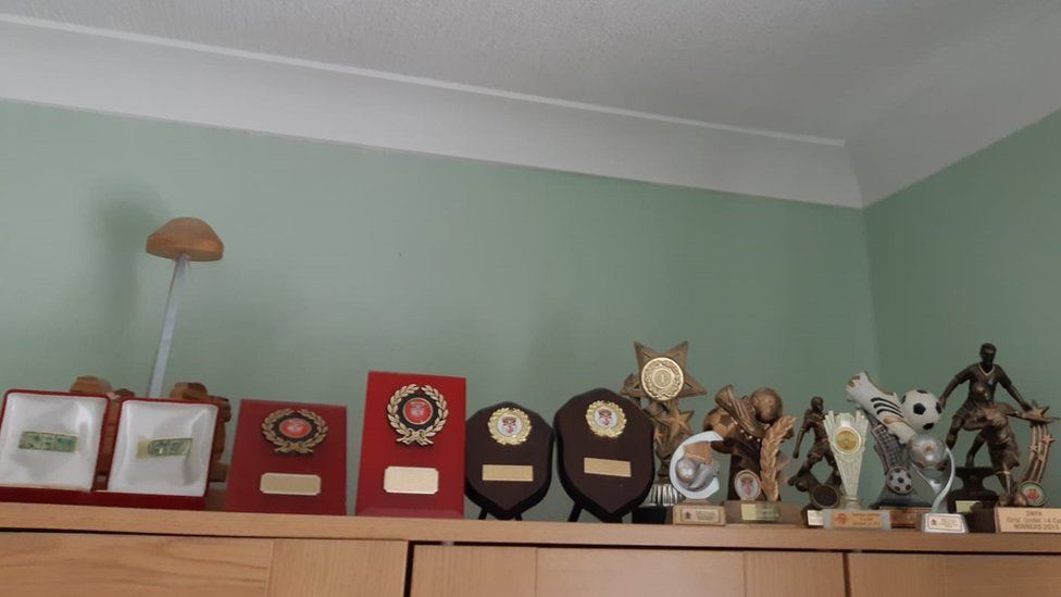 Hollie's sporting trophies at home